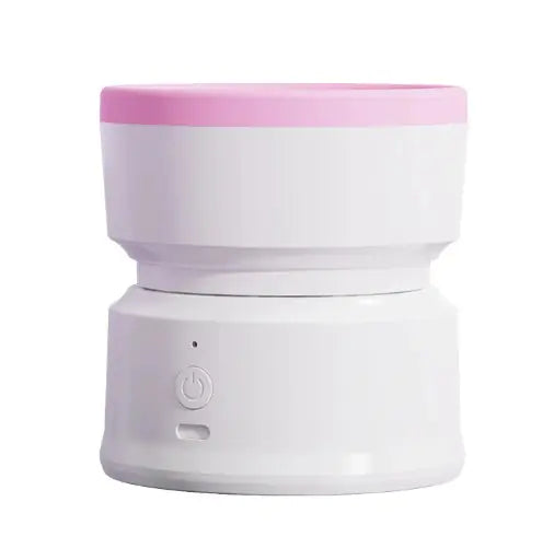 White cylindrical device with a pink top on a white background
