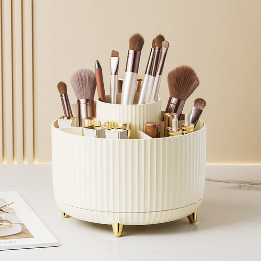 White cylindrical makeup brush holder with various brushes on a light surface.