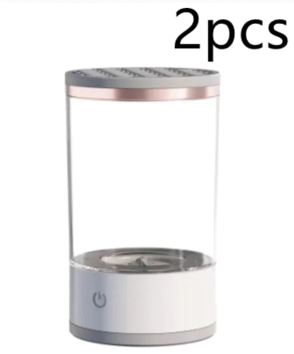 Two cylindrical containers with rose gold and silver accents on a white background.