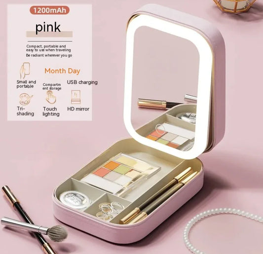 Pink makeup case with mirror and cosmetic items on a pink background