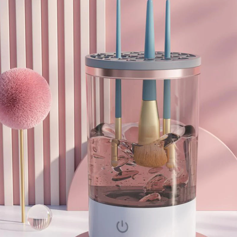 Makeup brush cleaner with brushes inside, on a pink and white striped background