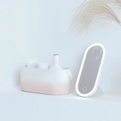 Luminous mirror with a white vase on a light gray background