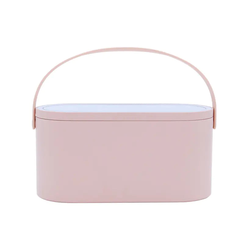 Pink oval container with a handle on a white background