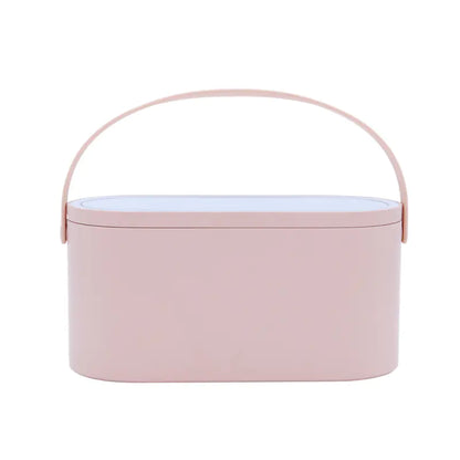 Pink oval container with a handle on a white background