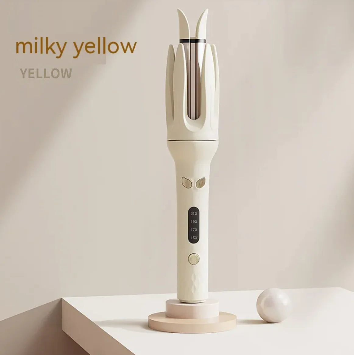 White hair straightener with brand name 'milky yellow' on a beige background