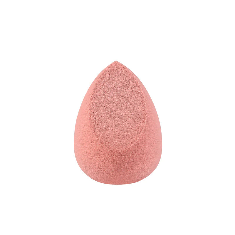 Pink makeup sponge on a white background