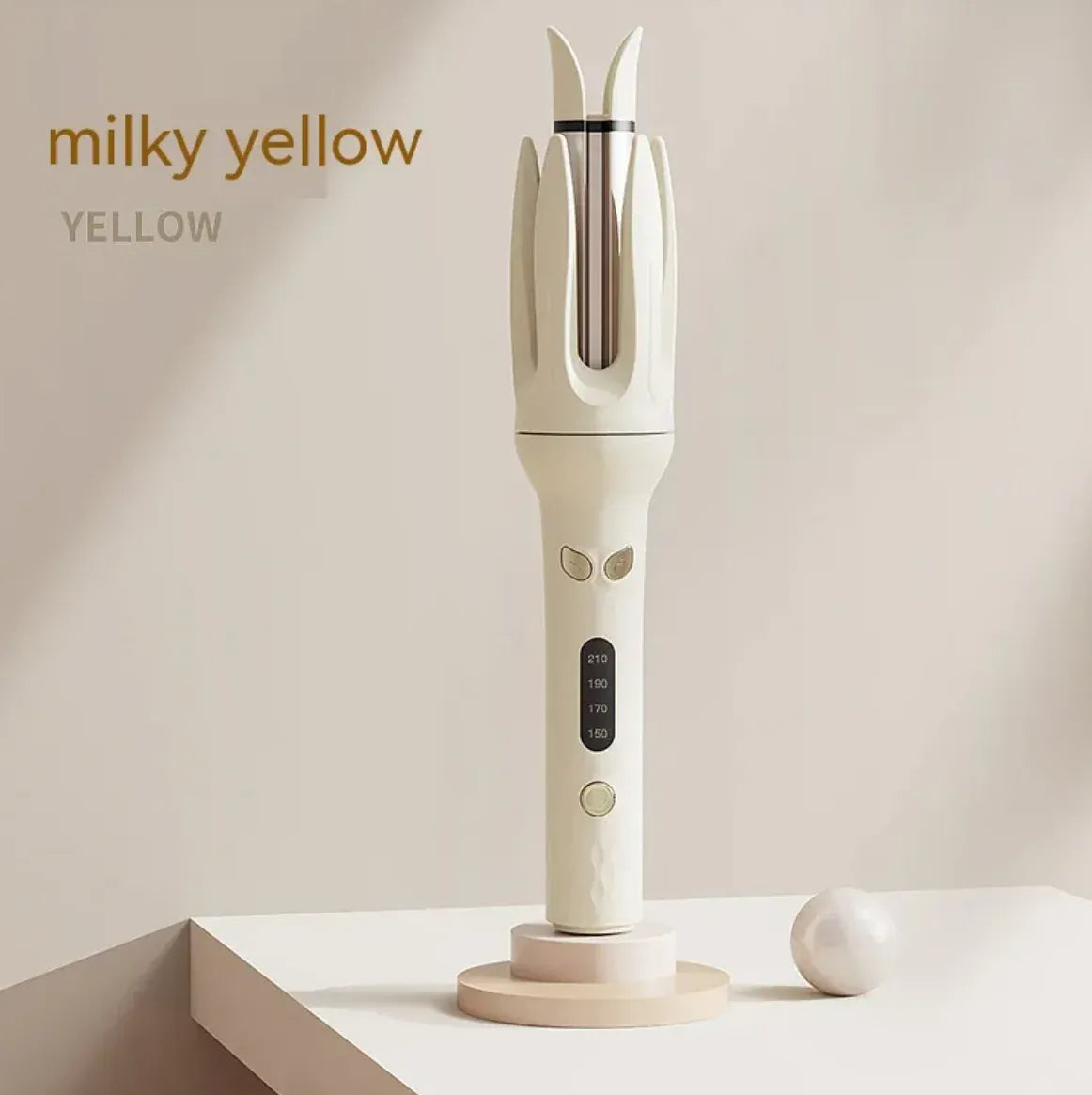 White hair straightening iron with brand name 'milky yellow' on a beige background