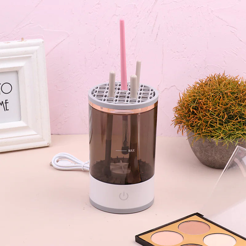 Umbrella dryer on a table with a pink wall and decorative items in the background