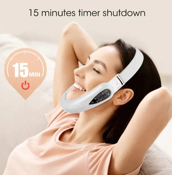 Woman wearing a white facial massager with a 15-minute timer on a beige background