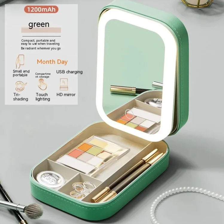 Green makeup case with LED light, compact mirror, and cosmetic items on a gray background