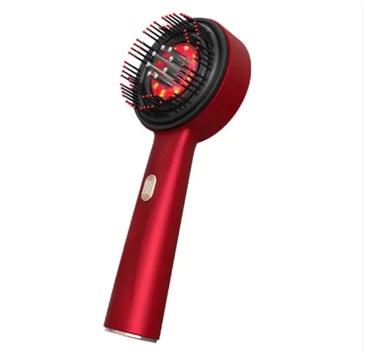 Red hair dryer with brush attachment on a white background
